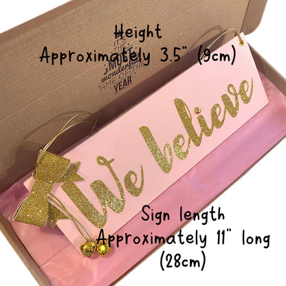 We Believe Wooden MDF Hanging Christmas Sign Pink Gold 11x3.5"
