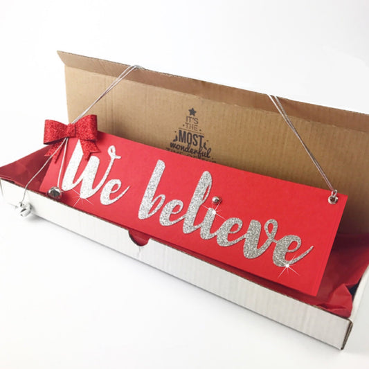 We believe sign Believe in the magic of Santa Claus Christmas decoration or Christmas Eve box filler in red and silver with bow