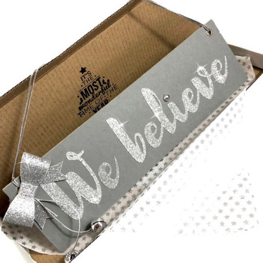 Grey We Believe sign, Grey and silver hanging christmas decoration for those who believe in Santa Claus