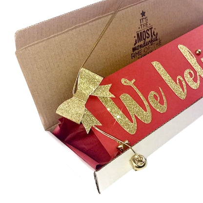 We believe sign Christmas decoration, Traditional red and gold Christmas wall hanging for those who believe in Santa